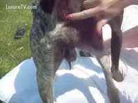 Blonde Girl with short hair has some outdoor joy with a dog